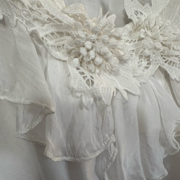 White silk made in Italy blouse. 3D flowers at v neckline. Ruffle front. - Picture 2 of 15